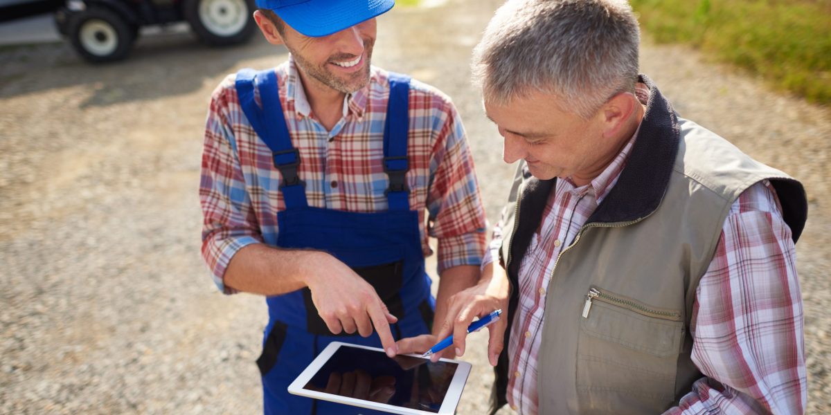 High angle view on modern farmers with digital tablet